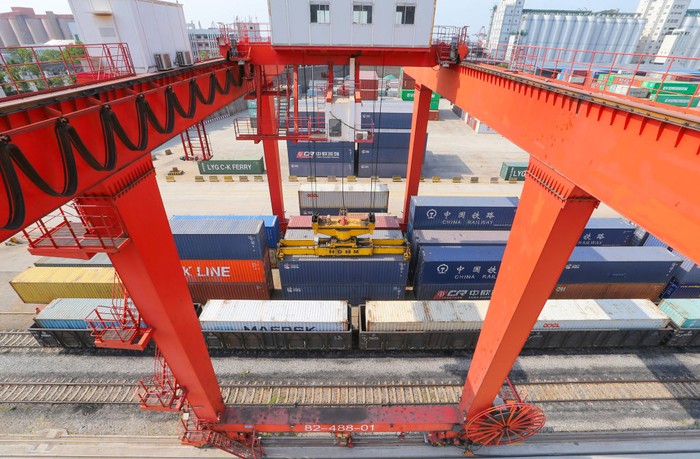 Belt and Road Initiative LIANYUNGANG, CHINA - JUNE 8, 2022 - A large machine lifts containers at the China-Kazakhstan Logistics Cooperation Base in Lianyungang, East China's Jiangsu province, June 8, 2022. The China-Kazakhstan Logistics Cooperation Base is the first physical platform project for international economic and trade cooperation under the Belt and Road Initiative, and has gradually become an international economic platform for transit transportation, warehousing, logistics and trade among the five Central Asian countries. (Photo credit should read CFOTO/Future Publishing via Getty Images)