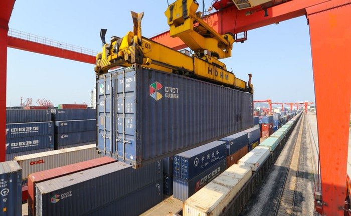LIANYUNGANG, CHINA - JUNE 8, 2022 - A large machine lifts containers at the China-Kazakhstan Logistics Cooperation Base in Lianyungang, East China's Jiangsu province, June 8, 2022. The China-Kazakhstan Logistics Cooperation Base is the first physical platform project for international economic and trade cooperation under the Belt and Road Initiative, and has gradually become an international economic platform for transit transportation, warehousing, logistics and trade among the five Central Asian countries. (Photo credit should read CFOTO/Future Publishing via Getty Images)