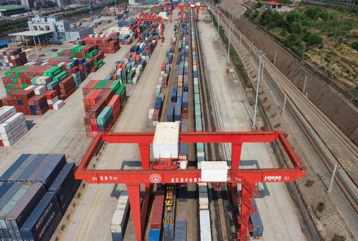 Belt and Road Initiative LIANYUNGANG, CHINA - JUNE 8, 2022 - A large machine lifts containers at the China-Kazakhstan Logistics Cooperation Base in Lianyungang, East China's Jiangsu province, June 8, 2022. The China-Kazakhstan Logistics Cooperation Base is the first physical platform project for international economic and trade cooperation under the Belt and Road Initiative, and has gradually become an international economic platform for transit transportation, warehousing, logistics and trade among the five Central Asian countries. (Photo credit should read CFOTO/Future Publishing via Getty Images)