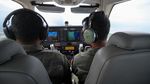 Sambut HUT Penerbangan TNI AL, Bonanza G-36 Terbang di Langit Surabaya