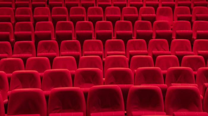Cinema theater with Red Seats. Red and empty theater seats in a row