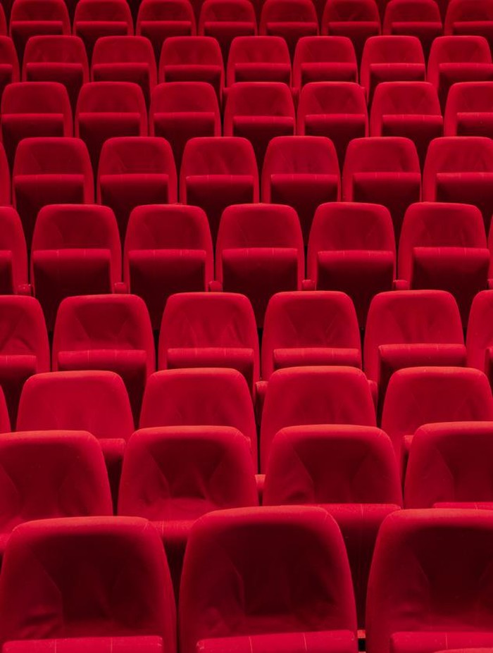Cinema theater with Red Seats. Red and empty theater seats in a row