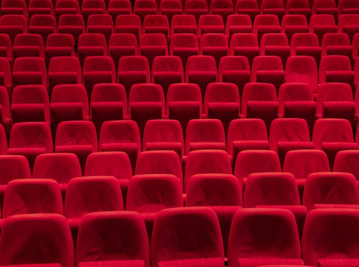 Cinema theater with Red Seats. Red and empty theater seats in a row