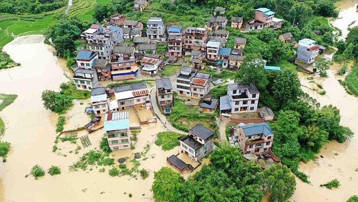 This aerial photo taken on June 13, 2022 shows flooded fields and buildings following heavy rains in Rongan in China's southern Guangxi region. - China OUT (Photo by AFP) / China OUT (Photo by STR/AFP via Getty Images)