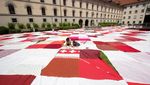 Gokil! Swiss Bikin Kain Piknik Raksasa hingga Tutupi Alun-alun Lho