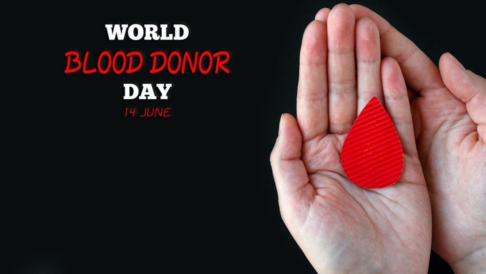 World Blood Donor Day. Concept of give blood donation, blood transfusion. Hands woman hold drop of blood on black background. World Hemophilia day. top view banner