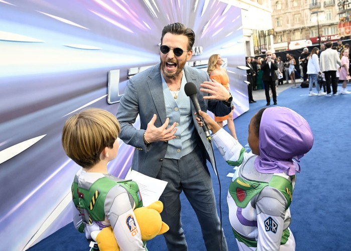 1402721701 LONDON, ENGLAND - JUNE 13: Chris Evans is interviewed by young fans at the UK Premiere of Disney Pixars'