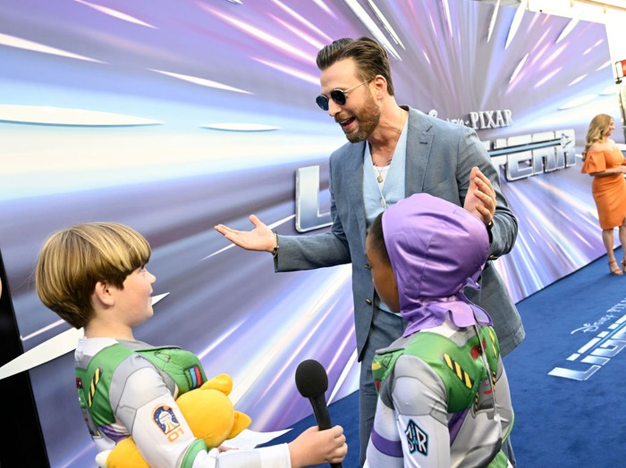 LONDON, ENGLAND - JUNE 13:  Chris Evans is interviewed by young fans at the UK Premiere of Disney Pixars' 