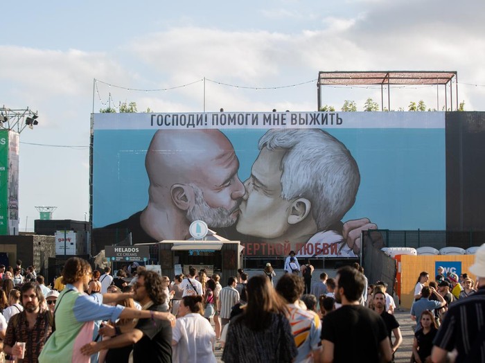 BARCELONA, CATALONIA, SPAIN - JUNE 09: A canvas with a drawing of a kiss between Manchester City coach Pep Guardiola (l) and AS Roma coach Jose Mourinho (r) on June 9, 2022, in Barcelona, Catalonia, Spain. This canvas replaces the one from last week's Primavera Sound Festival, in which the mayor of Barcelona, Ada Colau, and the president of the Community of Madrid, Isabel Diaz Ayuso, were kissing. This image is reminiscent of the famous graffiti of the kiss between communist leaders Erich Honecker and Leonidas Brezhnev on the Berlin Wall, and includes the message that is also read in this original work: 'My God, help me to survive this mortal love'. (Photo By David Zorrakino/Europa Press via Getty Images)