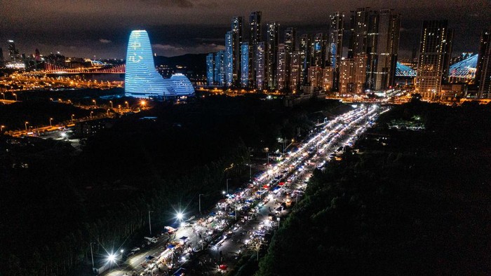 NANNING, CHINA - JUNE 13: People enjoy food at a night fair on June 13, 2022 in Nanning, Guangxi Zhuang Autonomous Region of China. (Photo by Chen Guanyan/China News Service via Getty Images)