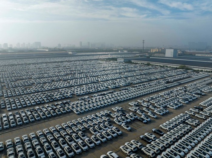 XIANGYANG, CHINA - JUNE 13: Aerial view of new Nissan vehicles sit parked at a parking lot of Xiangyang Fengshen Logistics Co. Ltd next to the Dongfeng Nissan Passenger Vehicle Company on June 13, 2022 in Xiangyang, Hubei Province of China. (Photo by VCG/VCG via Getty Images)