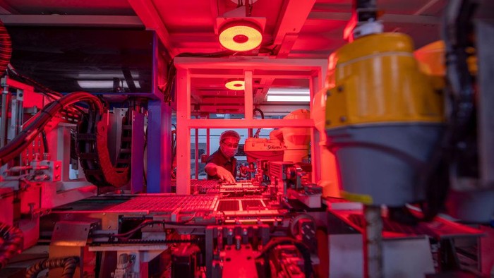 1403027995 YANGZHONG, CHINA - JUNE 15: An employee works on the production line of solar panels for export at a factory of Sunman Energy on June 15, 2022 in Yangzhong, Zhenjiang City, Jiangsu Province of China. (Photo by Song Wei/VCG via Getty Images)