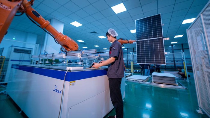 YANGZHONG, CHINA - JUNE 15: An employee works on the production line of solar panels for export at a factory of Sunman Energy on June 15, 2022 in Yangzhong, Zhenjiang City, Jiangsu Province of China. (Photo by Song Wei/VCG via Getty Images)