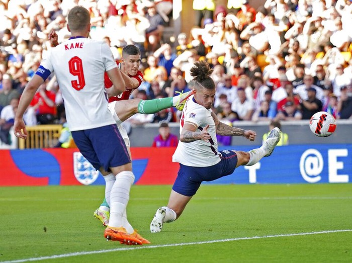 Hungary's Roland Sallai, center is congratulated after scoring the opening goal during the UEFA Nations League soccer match between England and Hungary at the Molineux stadium in Wolverhampton, England, Tuesday, June 14, 2022. (AP Photo/Jon Super)