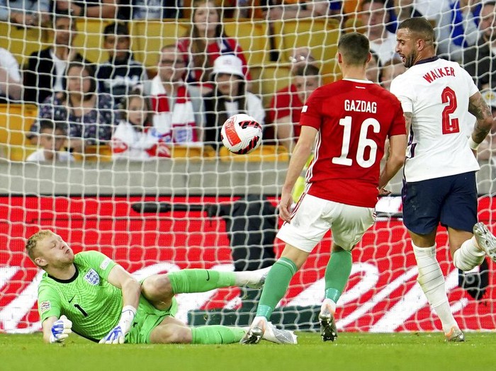 Hungary's Roland Sallai, center is congratulated after scoring the opening goal during the UEFA Nations League soccer match between England and Hungary at the Molineux stadium in Wolverhampton, England, Tuesday, June 14, 2022. (AP Photo/Jon Super)