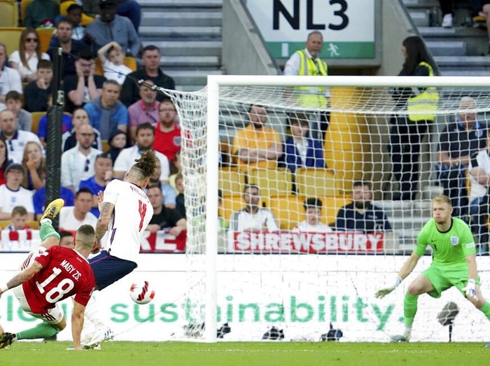 Hungary's Roland Sallai, center is congratulated after scoring the opening goal during the UEFA Nations League soccer match between England and Hungary at the Molineux stadium in Wolverhampton, England, Tuesday, June 14, 2022. (AP Photo/Jon Super)