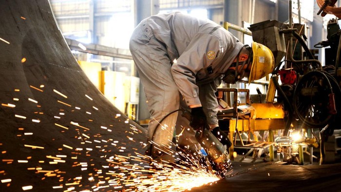 LIANYUNGANG, CHINA - JUNE 15, 2022 - A worker works on a production line at the Black Tower workshop of Zhongshan Wind Power Equipment Company in lianyungang Economic and Technological Development Zone, East Chinas Jiangsu Province, June 15, 2022. Industrial production rose 0.7 percent year-on-year in May, the National Bureau of Statistics (NBS) said Tuesday. On a month-on-month basis, the added value of industrial enterprises above designated size increased by 5.61 percent in May compared with the previous month. From January to May, the added value of industrial enterprises above designated size increased by 3.3 percent year-on-year. (Photo credit should read CFOTO/Future Publishing via Getty Images)