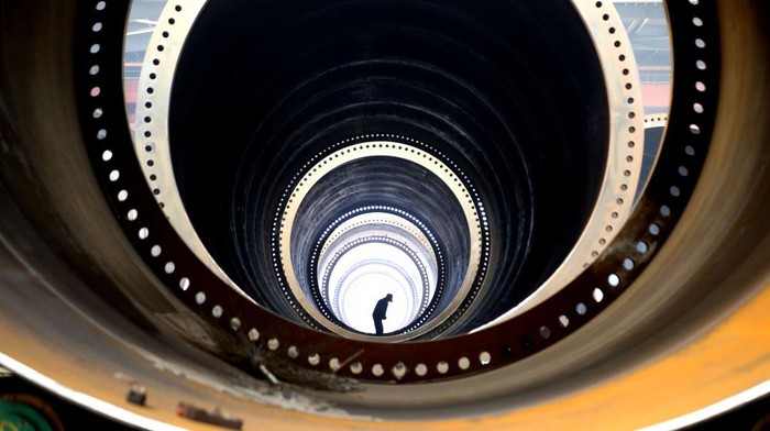 LIANYUNGANG, CHINA - JUNE 15, 2022 - A worker works on a production line at the Black Tower workshop of Zhongshan Wind Power Equipment Company in lianyungang Economic and Technological Development Zone, East Chinas Jiangsu Province, June 15, 2022. Industrial production rose 0.7 percent year-on-year in May, the National Bureau of Statistics (NBS) said Tuesday. On a month-on-month basis, the added value of industrial enterprises above designated size increased by 5.61 percent in May compared with the previous month. From January to May, the added value of industrial enterprises above designated size increased by 3.3 percent year-on-year. (Photo credit should read CFOTO/Future Publishing via Getty Images)