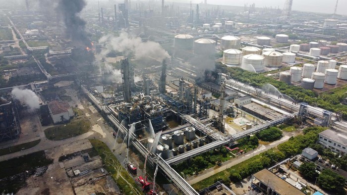 Smoke billows from a Sinopec Shanghai Petrochemical Co Ltd plant where a fire broke out, in Jinshan district of Shanghai, China June 18, 2022. REUTERS/Aly Song