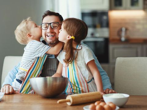 Happy Father's Day!father with children preparing food, baking cookies
