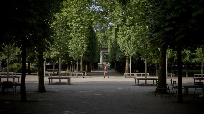 1403651674 PARIS, FRANCE - JUNE 18: A Parisian walks through the Tuileries Gardens in Paris as temperatures are expected to set a new record in the City for the hottest June day, peaking between 38Β°C-39Β°C, on June 18, 2022 in Paris, France. Outdoor public events across France have been cancelled as countries across Europe face high temperatures caused by the mass of hot air moving from north Africa, causing health risks as well as wild fires and energy shortages. (Photo by Kiran Ridley/Getty Images)
