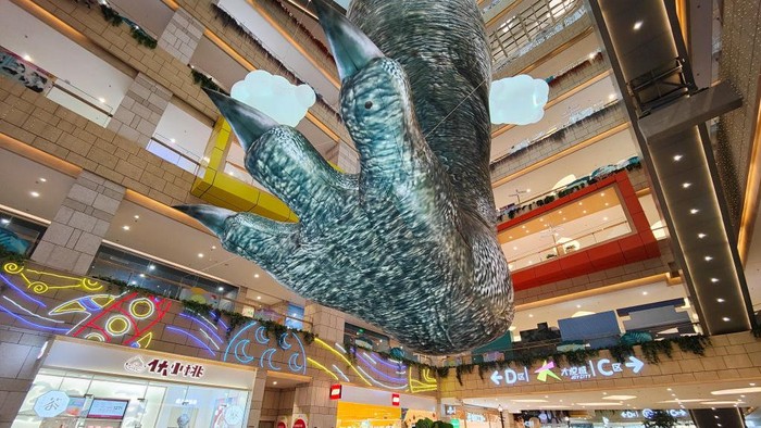 KUNMING, CHINA - JUNE 19: An inflatable dinosaur foot installation is seen at Joycity shopping mall on June 19, 2022 in Kunming, Yunnan Province of China. (Photo by Liu Ranyang/China News Service via Getty Images)