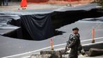 Kala Sinkhole di Tengah Jalan Guatemala Jadi Objek Foto Warga