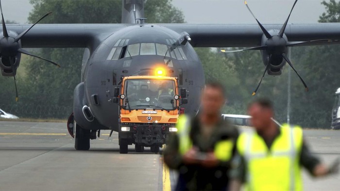 A member of the staff works on an A400 M airplane during the ILA Berlin Air Show in Schoenefeld near Berlin, Germany, Monday, June 20, 2022. The Berlin Air Show takes place from June 22 until June 26, 2022 at the Berlin ExpoCenter Airport fairground close to the airport Berlin Brandenburg (BER). (AP Photo/Michael Sohn)