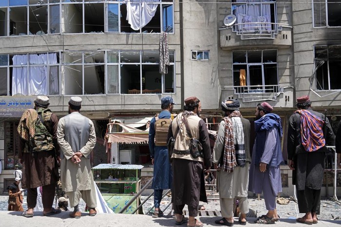 Taliban fighters gather at the site of an explosion in front of a Sikh temple in Kabul, Afghanistan, Saturday, June 18, 2022. Several explosions and gunfire ripped through a Sikh temple in Afghanistans capital. (AP Photo/Ebrahim Noroozi)
