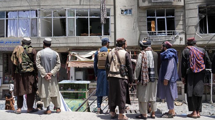 Taliban fighters gather at the site of an explosion in front of a Sikh temple in Kabul, Afghanistan, Saturday, June 18, 2022. Several explosions and gunfire ripped through a Sikh temple in Afghanistans capital. (AP Photo/Ebrahim Noroozi)