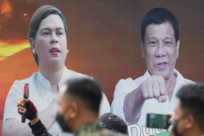 Sara Duterte Vice presidential candidate, Davao City Mayor Sara Duterte, running mate of Ferdinand Marcos Jr. shows the ink on her finger to mark that she has finished voting in Davao City, southern Philippines on Monday, May 9, 2022. Filipinos were voting for a new president Monday, with the son of an ousted dictator and a champion of reforms and human rights as top contenders in a tenuous moment in a deeply divided Asian democracy. (AP Photo/Manman Dejeto)