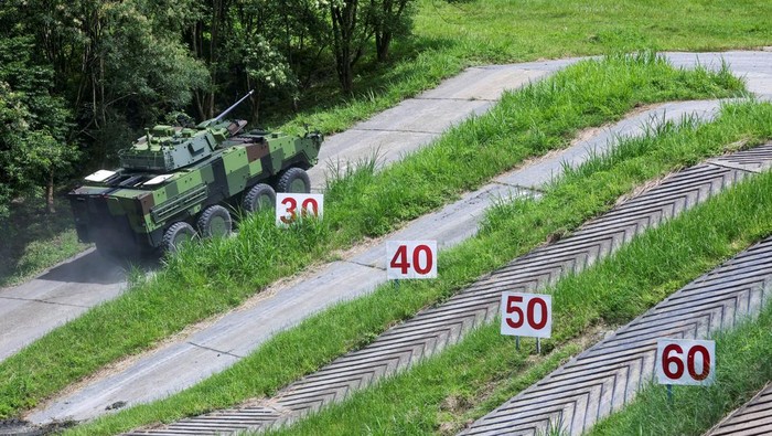 Taiwan Pamerkan Kendaraan Lapis Baja Buatan Lokal A member of the media takes photos of Taiwan military latest homemade armoured vehicle the CM-34