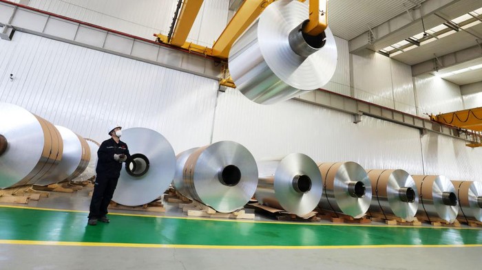 HUAIBEI, CHINA - OCTOBER 17: An employee works on the production line of aluminum foil at a factory on October 17, 2021 in Huaibei, Anhui Province of China. (Photo by Li Xin/VCG via Getty Images)
