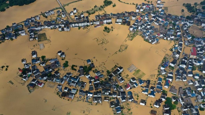 SHANGRAO, CHINA - JUNE 21: Aerial view of residential houses submerged in flood water on June 21, 2022 in Shangrao, Jiangxi Province of China. China's Jiangxi Province on Monday issued a red alert for floods. (Photo by Ai Shimin/VCG via Getty Images)