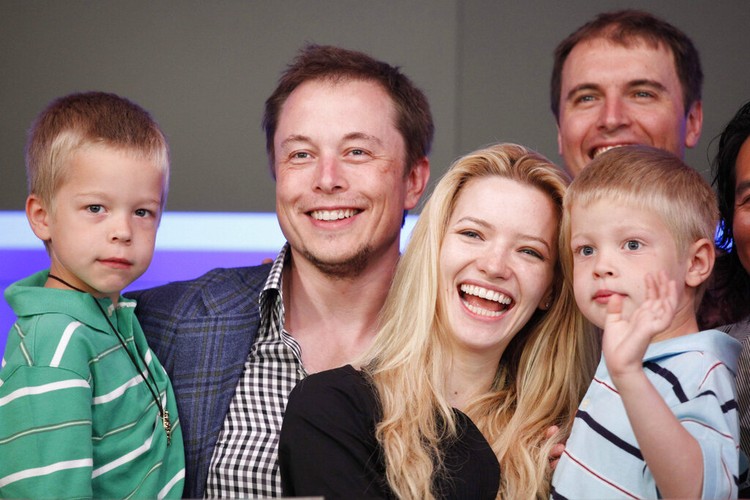 Elon Musk, CEO of Tesla Motors, stands with his fiancee Talulah Riley and his twin sons Griffin, left, 6, and Xavier at the Nasdaqs opening bell to celebrate the electric automakers initial public offering, Tuesday, June, 29, 2010, in New York. (AP Photo/Mark Lennihan)