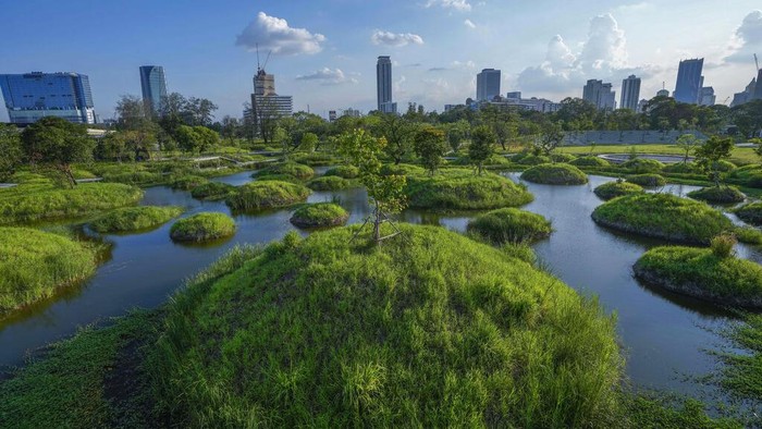 Peoples ride bicycles at Benjakitti Park in Bangkok, Thailand, Friday, April 1, 2022. Bursting with trees, ponds, plants and birdlife, the new inner-city park is delighting residents of Thailand’s bustling, congested capital. Every day, crowds visit Benjakitti Forest Park to savor a taste of nature in the heart of Bangkok. (AP Photo/Sakchai Lalit)