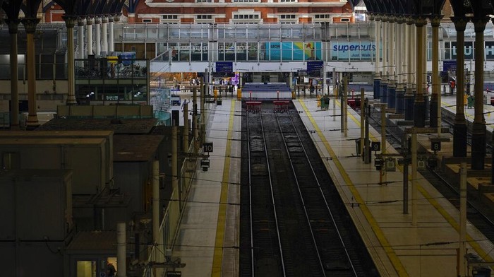 A near empty Liverpool Street station, in London, Tuesday, June 21, 2022. Britain's biggest rail strike in decades went ahead Tuesday after last-minute talks between a union and train companies failed to reach a settlement over pay and job security. Up to 40,000 cleaners, signalers, maintenance workers and station staff are due to walk out for three days this week, on Tuesday, Thursday and Saturday. (AP Photo/Alberto Pezzali)