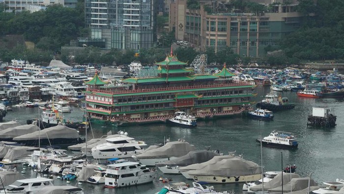 Hong Kongs iconic Jumbo Floating Restaurant is towed away in Hong Kong, Tuesday, June 14, 2022. Hong Kongs iconic restaurant on Tuesday departed the city, after its parent company failed to find a new owner and lacked funds to maintain the establishment amid months of COVID-19 restrictions. (AP Photo/Kin Cheung)