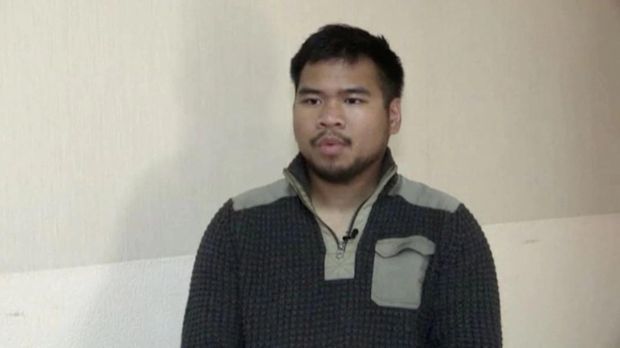 A still image taken from Russian state TV footage that it said shows Andy Huynh, a U.S. citizen captured by Russian forces while fighting for Ukraine, at an unknown location, in a still image from a video released on June 17, 2022. Video released June 17, 2022. RU-RTR/Handout via REUTERS TV