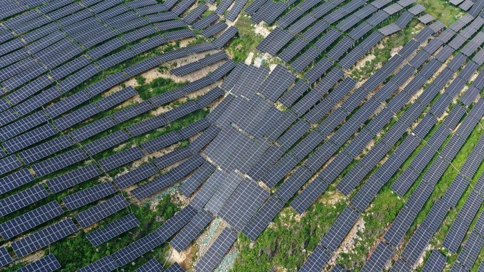 ANLONG, CHINA - JUNE 21, 2022 - An aerial photo taken on June 21, 2022 shows a photovoltaic power station in Xinjie Village, Puping Town, Anlong County, Buyi and Miao Autonomous Prefecture of Qiannan, Southwest Chinas Guizhou Province. In recent years, Guizhou province has taken advantage of barren hillsides to develop photovoltaic power stations and promote the construction of green and clean energy. (Photo credit should read CFOTO/Future Publishing via Getty Images)
