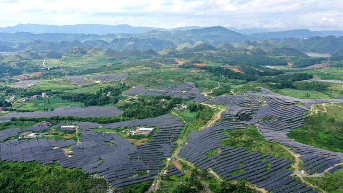 ANLONG, CHINA - JUNE 21, 2022 - An aerial photo taken on June 21, 2022 shows a photovoltaic power station in Xinjie Village, Puping Town, Anlong County, Buyi and Miao Autonomous Prefecture of Qiannan, Southwest China's Guizhou Province. In recent years, Guizhou province has taken advantage of barren hillsides to develop photovoltaic power stations and promote the construction of green and clean energy. (Photo credit should read CFOTO/Future Publishing via Getty Images)
