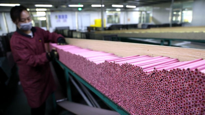 BINZHOU, CHINA - DECEMBER 27: Customs officers inspect the colored pencils for export at a pencil manufacturer factory on December 27, 2021 in Binzhou, Shandong Province of China. (Photo by Chu Baorui/VCG via Getty Images)