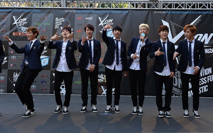 453472724 Members of Korean K-pop group BTS arrive on the red carpet during the K-CON 2014 (Korean Culture Convention) at the Los Angeles Memorial Sports Arena on August 10, 2014.  Having taken Asia by storm over the past decade with bubblegum looks and dance moves infused with military precision, South Korea's K-pop phenomenon continues to defy cultural barriers and find fans around the world. More Korean bands have multilingual members who can sing verses, carry choruses, and conduct interviews in English, Chinese, and Japanese so language is no longer a barrier.            AFP PHOTO/Mark RALSTON        (Photo credit should read MARK RALSTON/AFP via Getty Images)