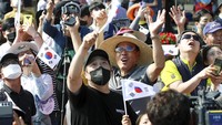 People watch the Nuri rocket, the first domestically produced space rocket, taking off from the launch pad near the Naro Space Center in Goheung, South Korea, Tuesday, June 21, 2022. South Korea launched its first domestically built space rocket on Tuesday in the countrys second attempt, months after its earlier liftoff failed to place a payload into orbit. (Chun Jung-in/Yonhap via AP)