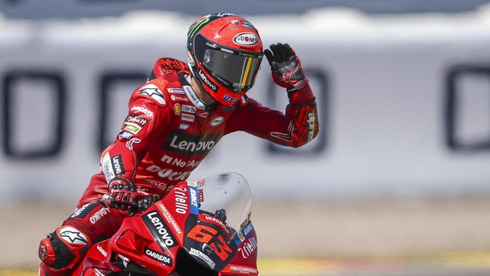 18 June 2022, Saxony, Hohenstein-Ernstthal: Motorsport/Motorcycle, German Grand Prix, MotoGP, Qualifying at Sachsenring. Francesco Bagnaia from Italy of the Ducati Lenovo Team cheers after his victory in qualifying. Photo: Jan Woitas/dpa (Photo by Jan Woitas/picture alliance via Getty Images)