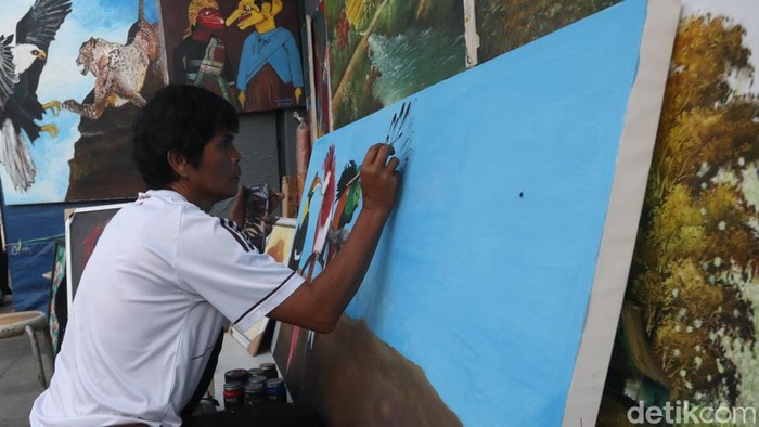 Damiang, pelukis di Jalan Braga, Bandung.