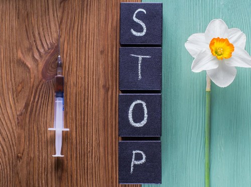 The concept of stop drug addiction. Choosing between drugs and a healthy lifestyle.