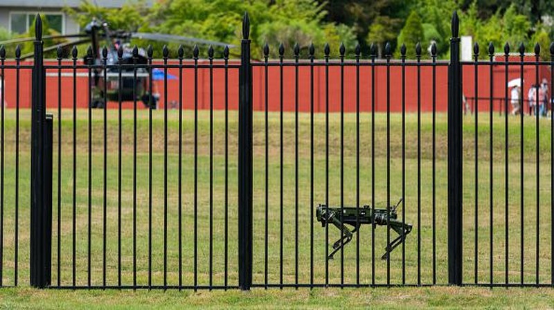 SEOUL, SOUTH KOREA - 2022/06/16: A security 'dog' robot patrols in front of the new presidential office in Seoul. The presidential office will be called the 