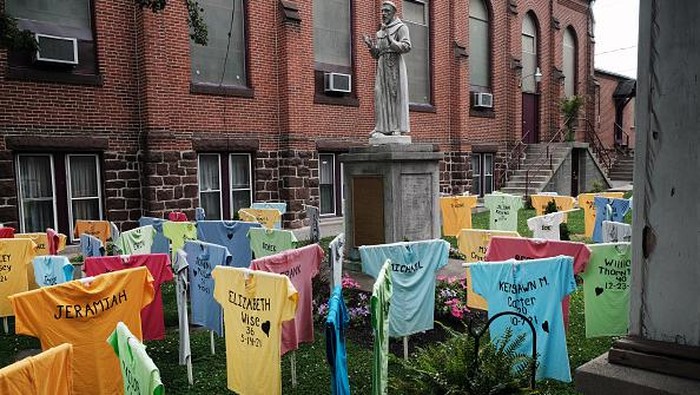 HARRISBURG, PENNSYLVANIA - JUNE 22: Shirts representing victims of gun violence in Harrisburg are displayed in a memorial at St. Francis Catholic Church on June 22, 2022 in Harrisburg, Pennsylvania. The gun violence awareness memorial was installed by the Harrisburg Chapter of Heeding God’s Call to End Gun Violence. The memorial includes 64 shirts with the names, ages and dates of death of those killed in gun violence  in Harrisburg and neighboring communities from 2019 through the present. Since 2009, 199 people have been fatally shot in the capital city. (Photo by Spencer Platt/Getty Images)