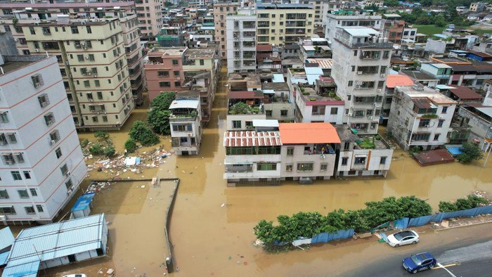 QINGYUAN, CHINA - JUNE 22: Aerial view of residential houses surrounded by flood water after torrential rains on June 22, 2022 in Qingyuan, Guangdong Province of China. Flood control authority of China's Guangdong Province activated a Level-I emergency response on Tuesday. (Photo by VCG/VCG via Getty Images)